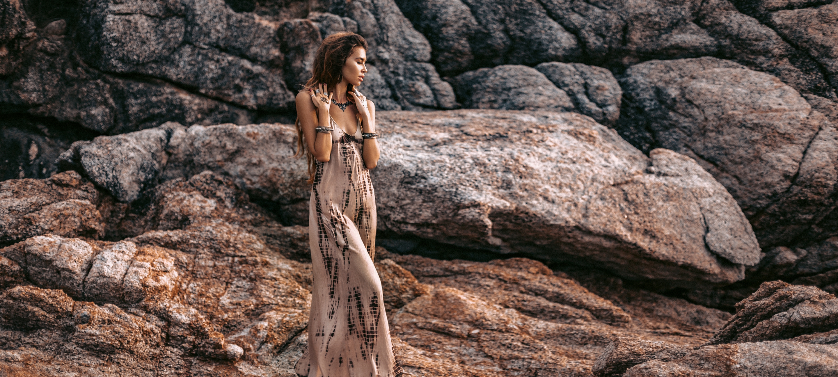 Beautiful,Young,Boho,Style,Woman,On,Stones,Background,At,Sunset